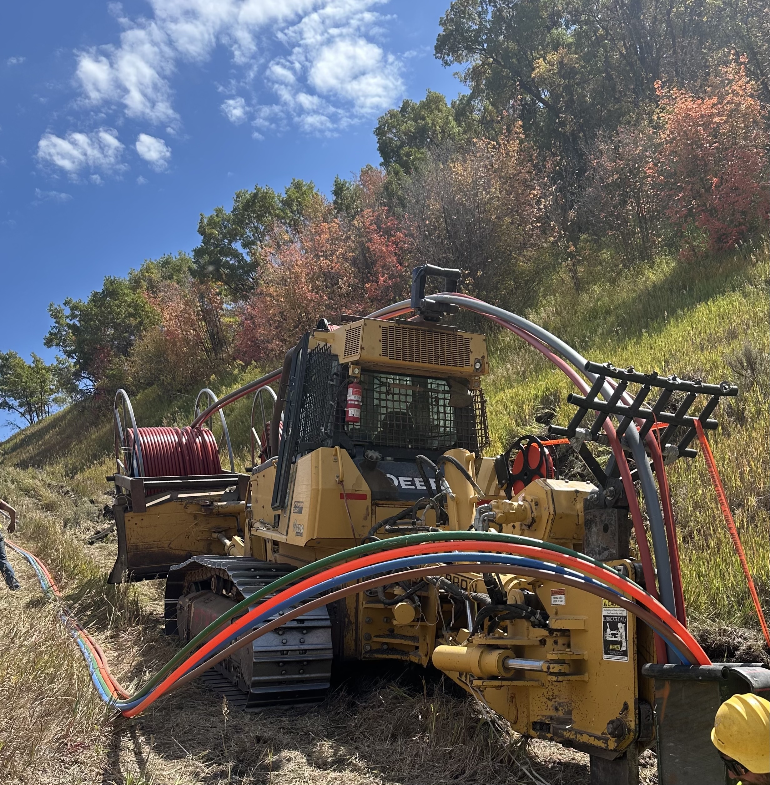 Conduit installation on a steep hillside